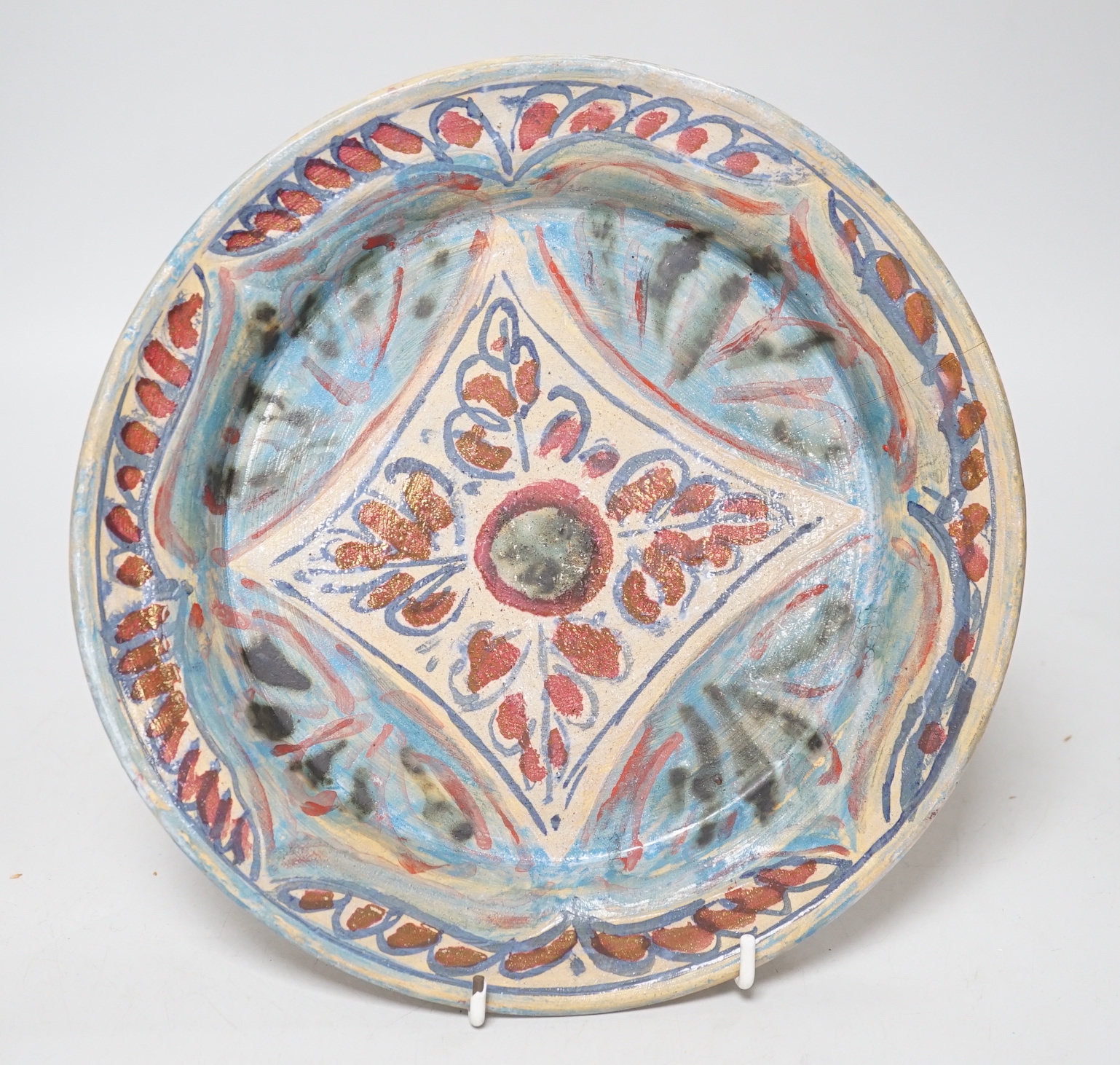 Quentin Bell (1910-1996) - Fulham pottery dish with stylised decoration, signed and stamped to the base (cracked), 24.5cm in diameter